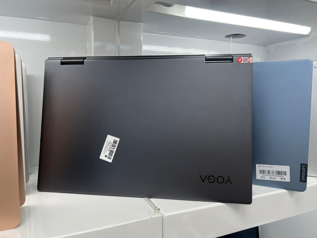 Lenovo Yoga C740 closed, showing the dark grey lid with the Yoga logo