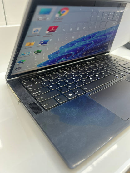 Angled view of the Lenovo Yoga C740 keyboard and hinge, showing the slim aluminium chassis
