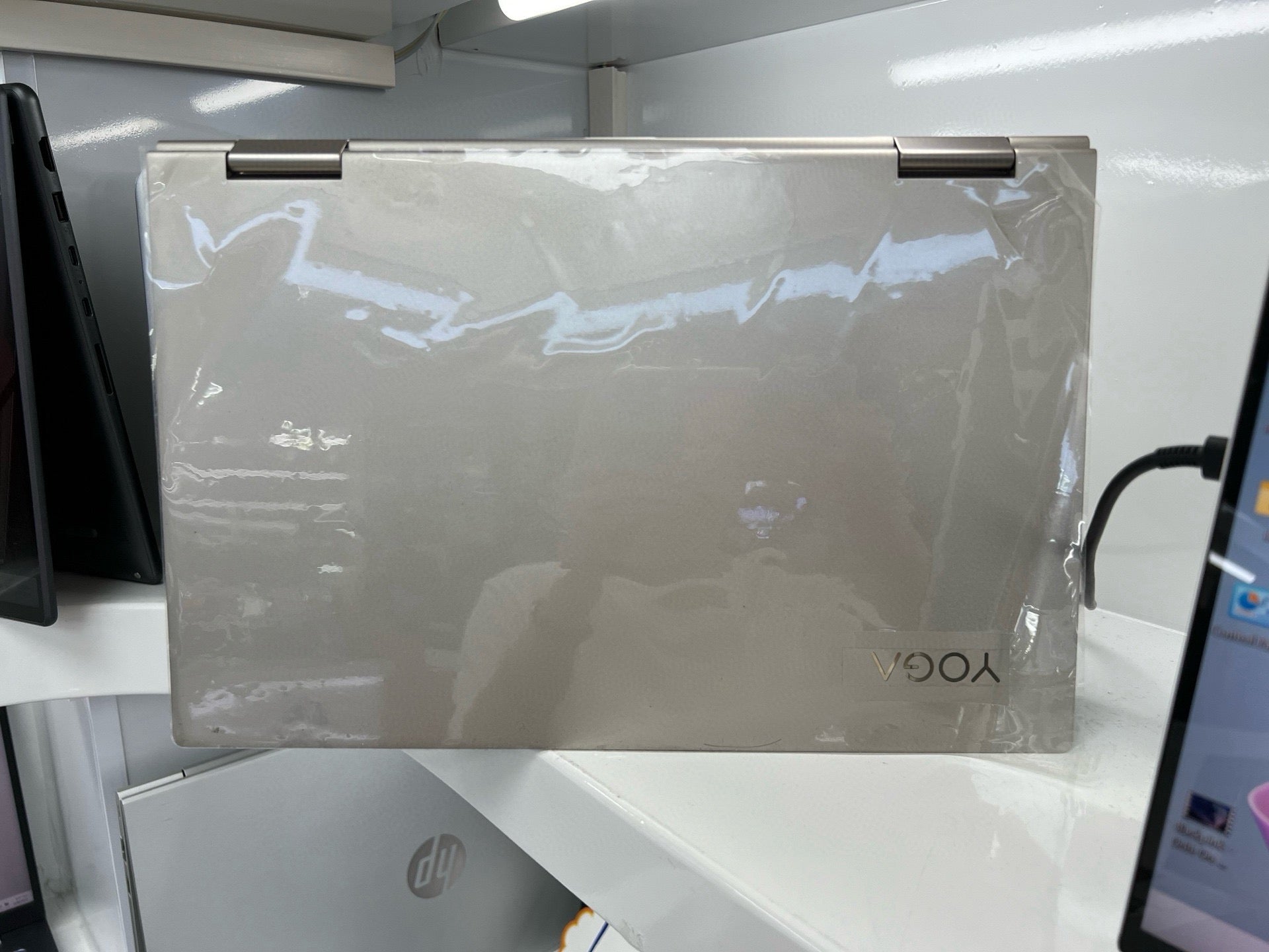 Lenovo Yoga C740 in champagne gold, closed, with protective film applied
