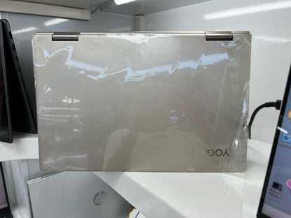 Lenovo Yoga C740 in champagne gold, closed, with protective film applied